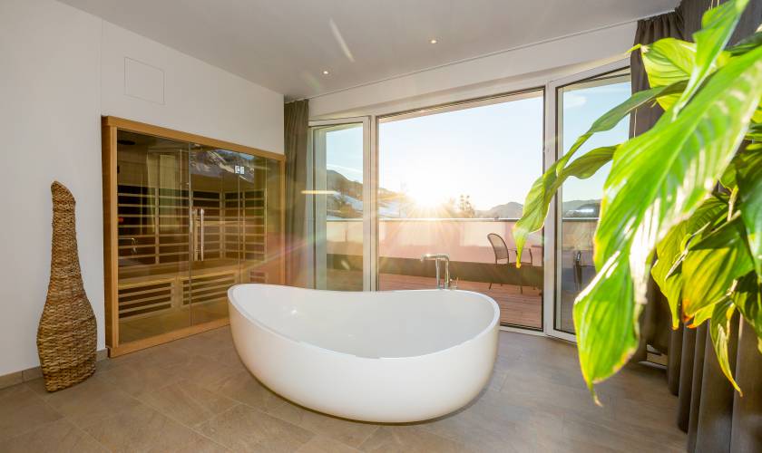 Indoor view suite with bathtub and sauna with balcony
